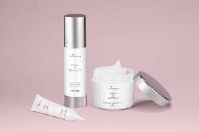 skinMedica Even & Correct skincare packaging—serum, eye treatment, and cream—arranged on a pink background.