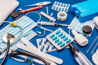 Set of diverse medical items. Means for the prevention, personal hygiene and treatment of the symptoms of coronavirus. COVID-19 pandemic, 2019-nCoV worldwide concept. Trendy blue color background